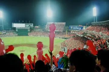 The crowd, blowing up the balloons