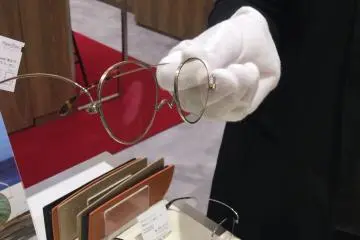 Staff demonstrating the finer points of their glasses