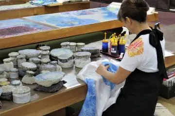 Watch the artisans at work and see how exquisite their ten-step process is. 