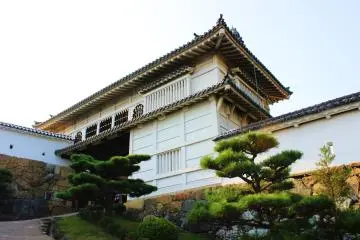 The might of medeival architecture juxtaposed with the delicate nature of Japanese gardening