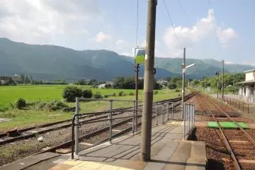 Mountains and rice fields surround the station