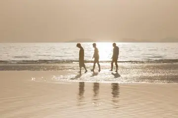 Youngsters walking on this beach makes a good picture