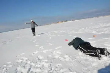 The water is frozen solid in winter, and so flat that you can use it for fun photo opportunities