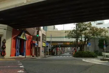 A view under the rail tracks; the road leads to Matsukage-cho