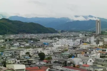 The steam rising from the mountains in the distance.