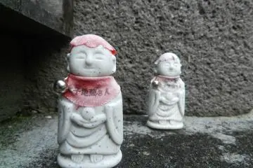 Tiny gods with happy faces.