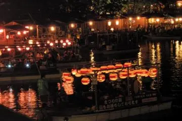 Pleasure boats take customers onto the lake to enjoy the festivities