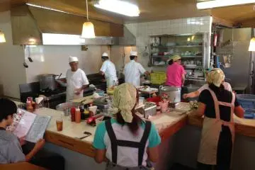 <p>The interior isn't grandly decorated but its fun to watch the employees shuffle about the kitchen and dining area to feed the usually packed restaurant of customers</p>