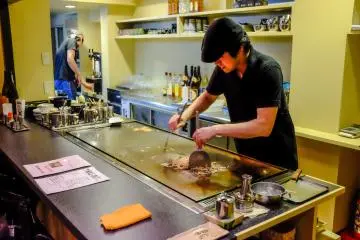 You can watch the chefs prepare your okonomiyaka and yakisoba dishes in Jyuzo