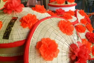 The iconic hanagasa hats with their bright red flowers.