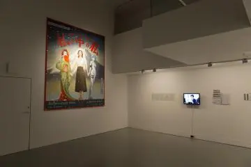 Also on display was large painting of the three motifs of the film. The film was a juxtaposition of Jidaki geki films, the works of Yasujirō Ozu as well as anime such as Evangelion