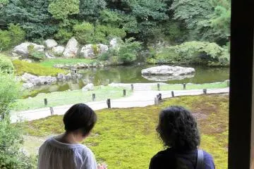 Visitors enjoying the view from the veranda