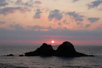 The sun setting between the rocks on the summer solstice in June.