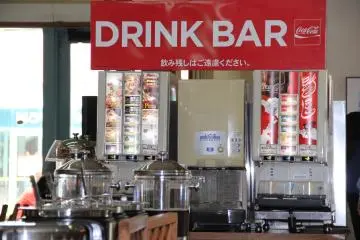 Curry rice and soup in the foreground are only available during the lunch buffet; the drink bar offers sodas, teas, frozen slush drinks and coffee