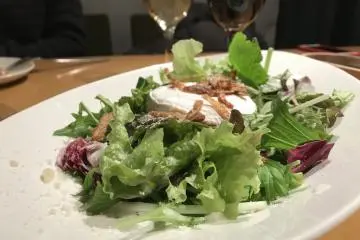 French Cheese dressed in a salad