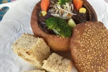 Tender beef stew in homemade bread