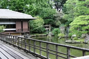 A tiny waterfall is hidden behind this old tea house