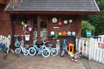 Outside, you can see all the bikes and balls lined up. There is no extra charge to use these. There is also a playground, ping pong and basketball hoops.