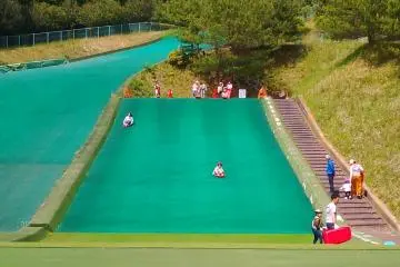 Grass sledging at Nasunogahara Park.
