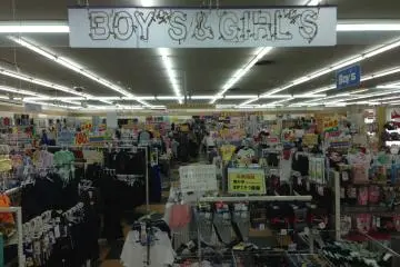 <p>Large signage in English makes it easy to find the area of the store desired</p>