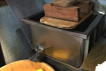 Massive presses at the tofu maker at Nishiki Food Markets in Central Kyoto