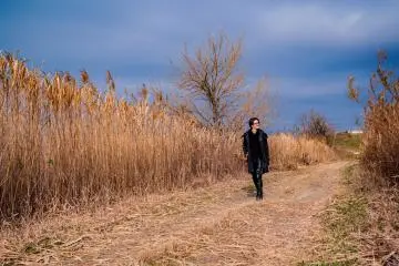 Dwarfed by the towering reeds!