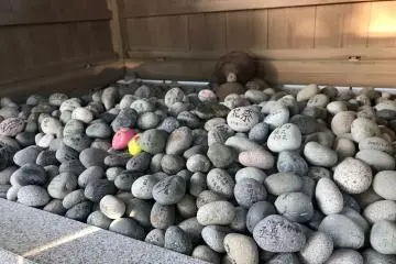 Stones with children's names written on them at the Kodakara Ishi Nassho