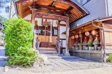 Tiny temple with jizo statues watching the street