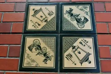 Tiles of gas lamps and horse drawn carriages on the Bashamichi avenue