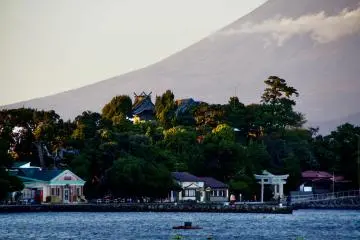 A torii at Cape Osé with Mount Fuji rising in the background