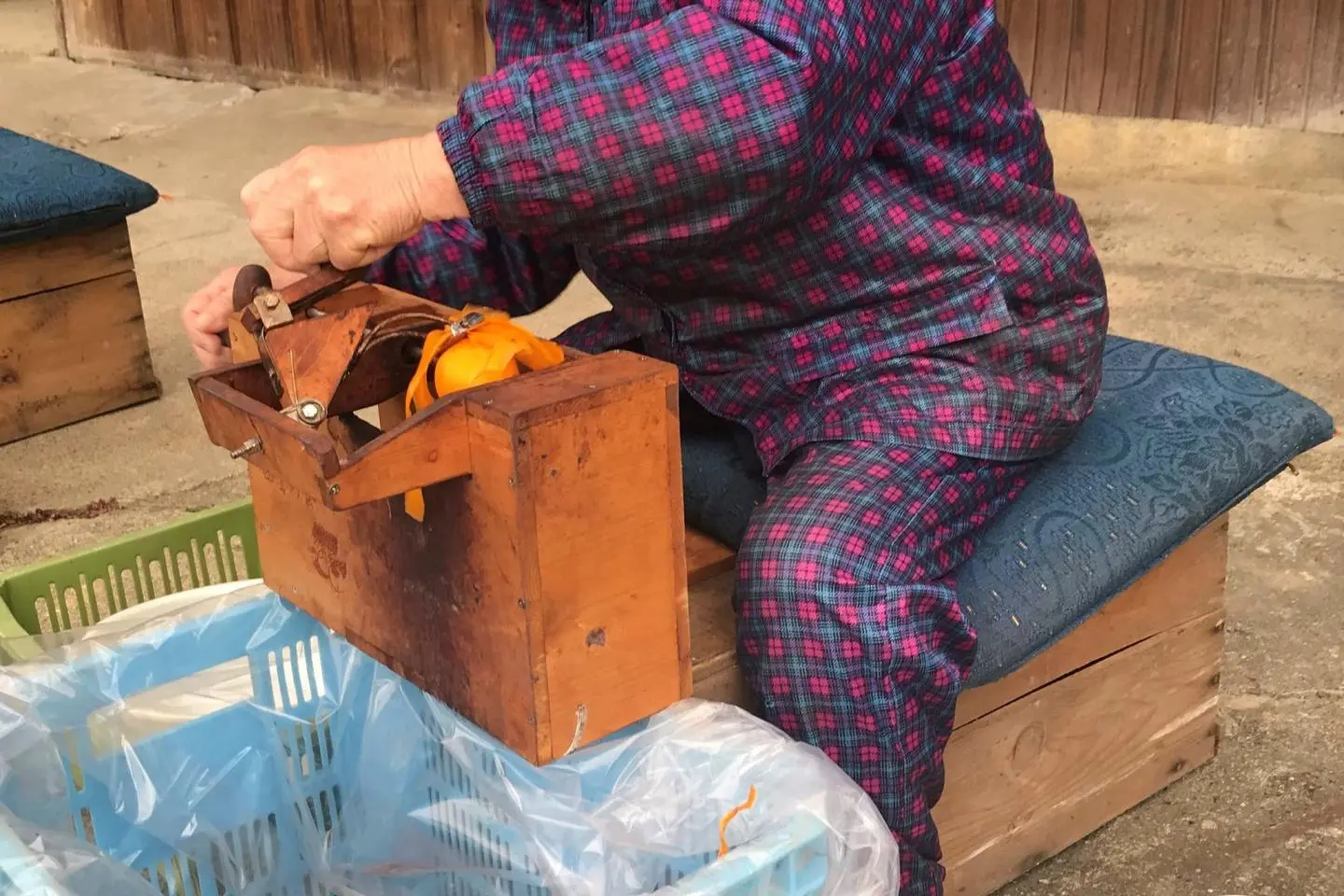 Here is your role model. This woman has been peeling persimmon all her life. 