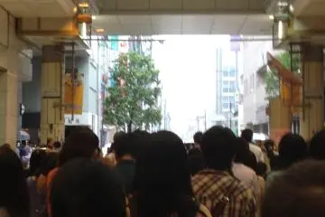 The crowd stops and looks up to see a gospel group performing above the shopping mall at Jozenji Street Jazz Festival Sendai