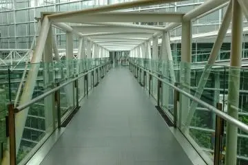 The asymmetrical glass bridges connect each side of the building and allow you to view the building from every perspective