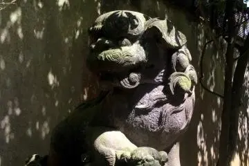 A lion dog greets you as you approach the shrine