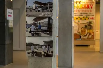 Images of the aftermath of 2011's Sendai quake line pillars near the entrance to the first floor exhibitions