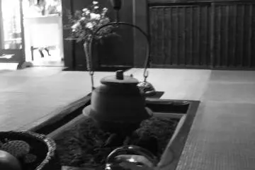 <p>Looking past the hearth into one of the dining areas</p>