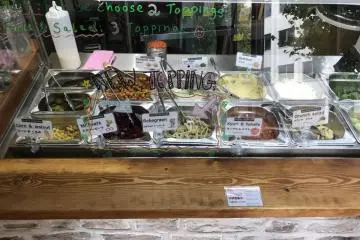 There are numerous salad and sauce options to fill your falafel sandwich with