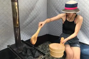 Pour water on the hot stones, if you like it hotter and very hot