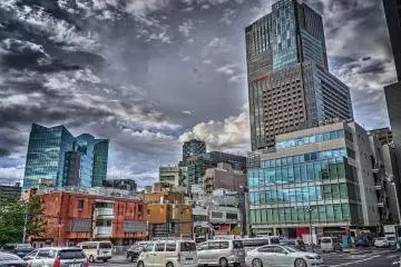Midtown Tower is the tallest building in the background of the photo