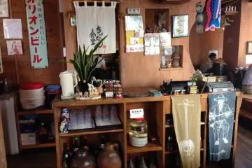 <p>The restaurant is festooned with a blend of traditional Ryukyuan accents and 20th century Japanese pop culture</p>