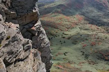 The south flank is straight down