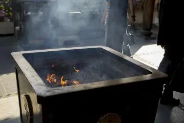 Offerings of incense fill the air with a sweet smoke at Isshinji Tennoji