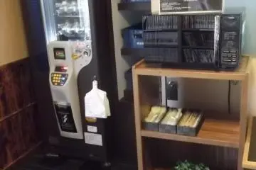 Vending machine and microwave