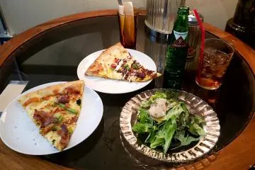 Lunch set. Includes 2 slices, a soft drink  and a salad. Very reasonably priced.