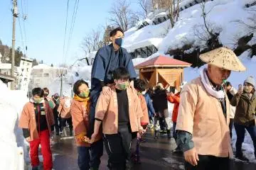 New grooms are paraded around the area before being thrown off a 5 meter cliff