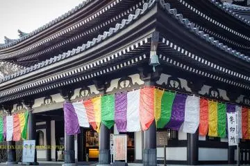 Main hall adorned with Buddhist banners.