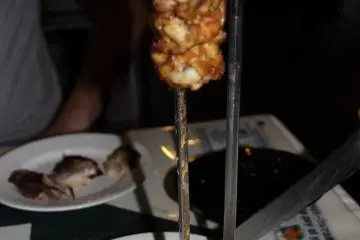 <p>The true culinary pleasure of Bovino's is in its many imported Brazilian meats that are delivered to the table on a large skewer</p>