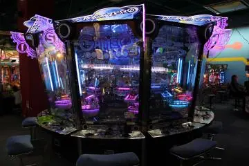 <p>There is a vast array of these types of games in which special tokens are inserted to try to win back the same type of token; if you are skillful the tokens can be turned in for snacks or prizes</p>