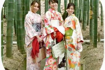 Girls wearing traditional kimonos in the bamboo grove