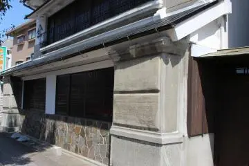 The large stone base and pillars make this building standout from the others